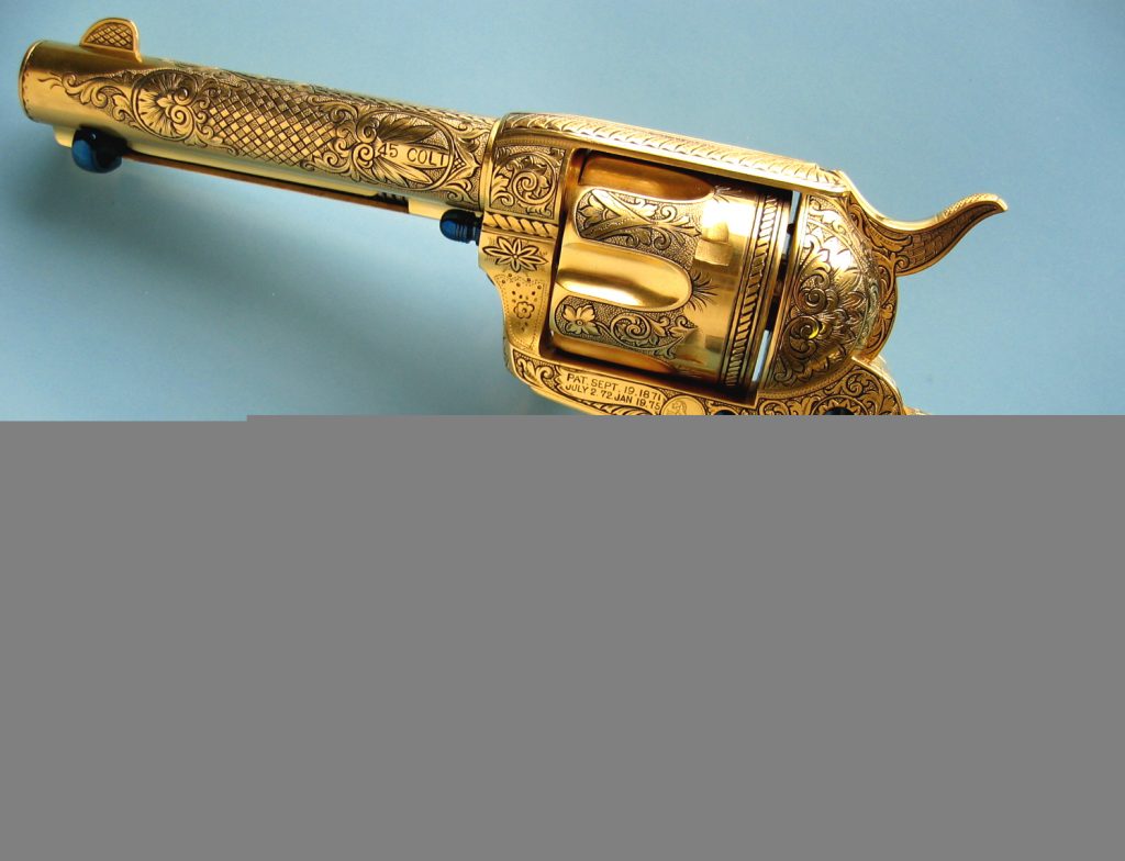 Antique gold hand gun
