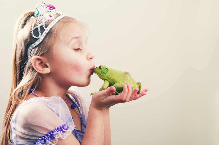 young princess kissing a frog