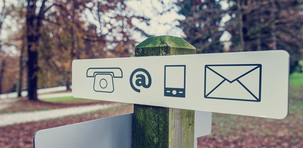 signpost with different contact icons